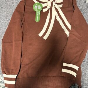 Elegant Brown and Cream Sweater with Bow Accent